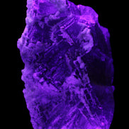 Fluorite snow steppes 137*55*65mm 1080g in UV light - Rocks and Things Store