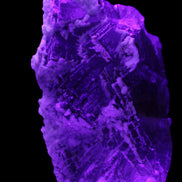 Fluorite snow steppes 137*55*65mm 1080g in UV light - Rocks and Things Store