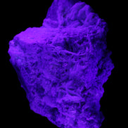 Green and Pink Tourmaline in Lepidolite, Feldspar and Quartz matrix 150*131*60mm 1204g in UV light - Rocks and Things Store