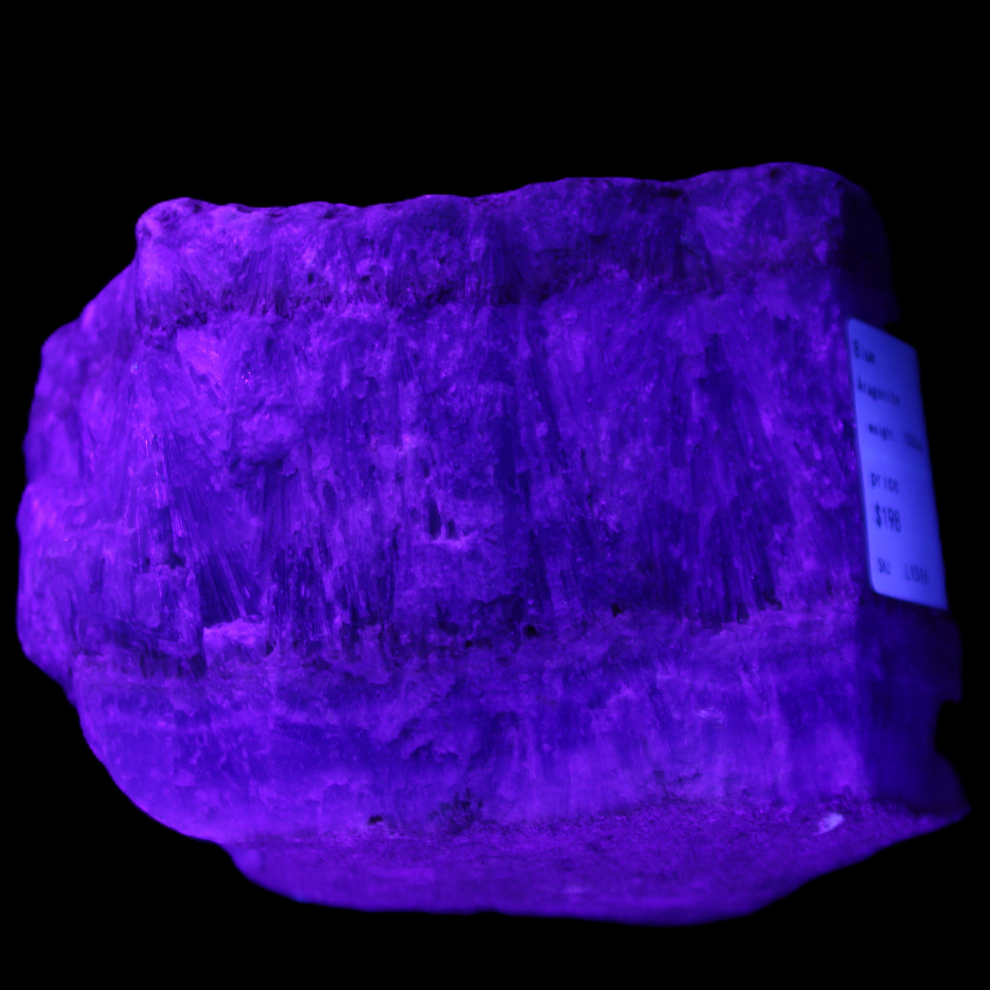 Awesome Blue Aragonite 100*83*71mm 1035g in UV light - Rocks and Things Store