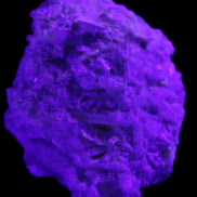 Green Tourmaline cluster on matrix 60*45*37mm 111.8g in UV light - Rocks and Things Store