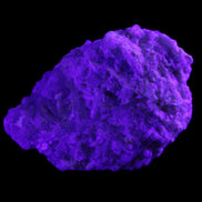 Green Tourmaline cluster on matrix 60*45*37mm 111.8g in UV light - Rocks and Things Store