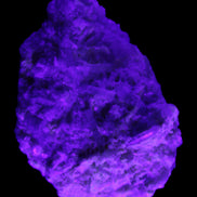 Green Tourmaline cluster on matrix 60*45*37mm 111.8g in UV light - Rocks and Things Store