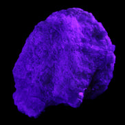 Green Tourmaline cluster on matrix 60*45*37mm 111.8g in UV light - Rocks and Things Store