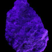 Green Tourmaline cluster on matrix 60*45*37mm 111.8g in UV light - Rocks and Things Store