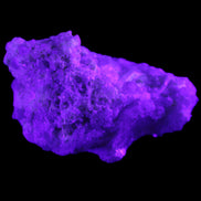 Green Tourmaline cluster on matrix 60*45*37mm 111.8g in UV light - Rocks and Things Store