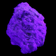 Green Tourmaline cluster on matrix 60*45*37mm 111.8g in UV light - Rocks and Things Store