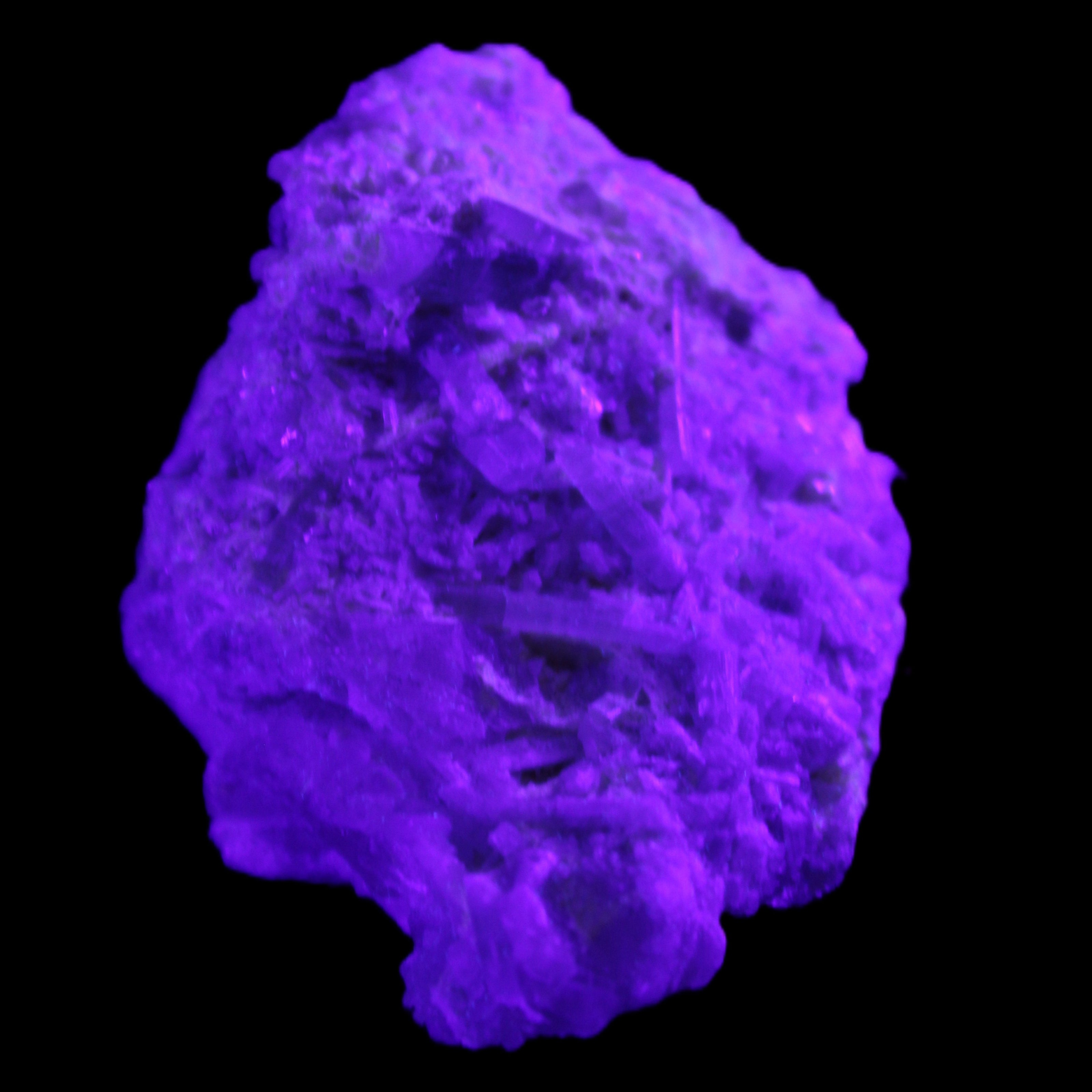 Green Tourmaline cluster on matrix 60*45*37mm 111.8g in UV light - Rocks and Things Store