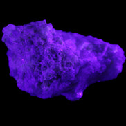 Green Tourmaline cluster on matrix 60*45*37mm 111.8g in UV light - Rocks and Things Store