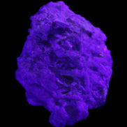 Green Tourmaline cluster on matrix 60*45*37mm 111.8g in UV light - Rocks and Things Store