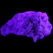 Green Tourmaline cluster on matrix 60*45*37mm 111.8g in UV light - Rocks and Things Store