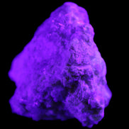 Green Tourmaline cluster on matrix 60*45*37mm 111.8g in UV light - Rocks and Things Store