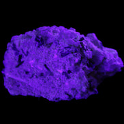 Green Tourmaline cluster on matrix 45*26*20mm 14.8g in UV light - Rocks and Things Store