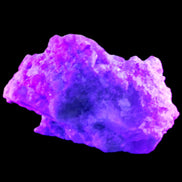 Pink and Clear Tourmaline in Lepidolite, Feldspar and Quartz matrix 90*45*50mm 188.7g in UV light - Rocks and Things Store