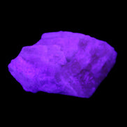Pink Fluorescent White Calcite crystal 42*28*23mm 41g in UV light - Rocks and Things Store