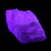 Pink Fluorescent White Calcite crystal 42*28*23mm 41g in UV light - Rocks and Things Store
