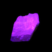 Pink Fluorescent White Calcite crystal 42*28*23mm 41g in UV light - Rocks and Things Store