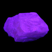 Pink Fluorescent White Calcite crystal 42*28*23mm 41g in UV light - Rocks and Things Store