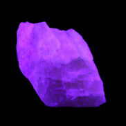 Pink Fluorescent White Calcite crystal 42*28*23mm 41g in UV light - Rocks and Things Store