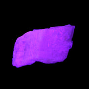 Pink Fluorescent White Calcite crystal 42*28*23mm 41g in UV light - Rocks and Things Store