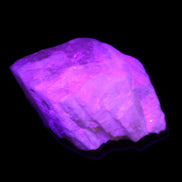 Pink Fluorescent White Calcite crystal 42*28*23mm 41g in UV light - Rocks and Things Store