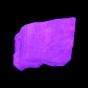 Pink Fluorescent White Calcite crystal 42*28*23mm 41g in UV light - Rocks and Things Store