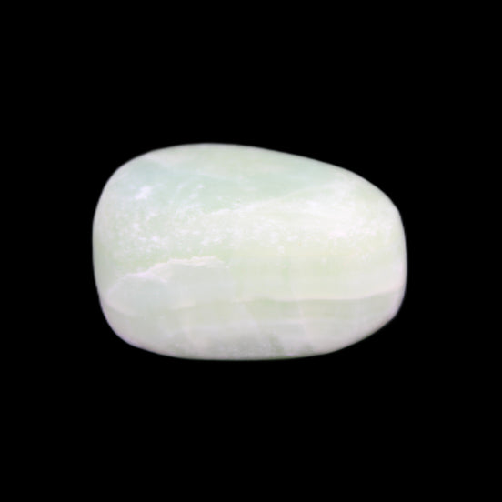 Pistachio Calcite tumbled stone 14-24g in sunlight - Rocks and Things Store