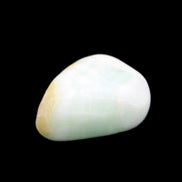 Pistachio Calcite tumbled stone 14-24g in sunlight - Rocks and Things Store