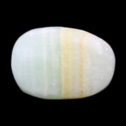 Pistachio Calcite tumbled stone 14-24g in sunlight - Rocks and Things Store