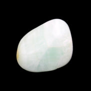 Pistachio Calcite tumbled stone 14-24g in sunlight - Rocks and Things Store