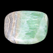 Pistachio Calcite tumbled stone 38*32*14mm 34g in sunlight - Rocks and Things Store