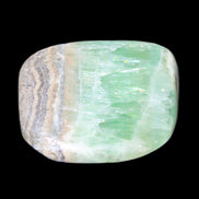 Pistachio Calcite tumbled stone 38*32*14mm 34g in sunlight - Rocks and Things Store