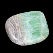 Pistachio Calcite tumbled stone 38*32*14mm 34g in sunlight - Rocks and Things Store