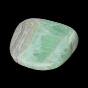 Pistachio Calcite tumbled stone 38*32*14mm 34g in sunlight - Rocks and Things Store