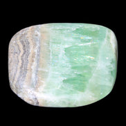 Pistachio Calcite tumbled stone 38*32*14mm 34g in sunlight - Rocks and Things Store