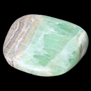 Pistachio Calcite tumbled stone 38*32*14mm 34g in sunlight - Rocks and Things Store
