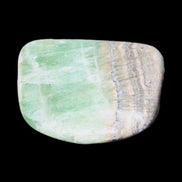 Pistachio Calcite tumbled stone 38*32*14mm 34g in sunlight - Rocks and Things Store