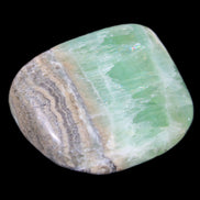 Pistachio Calcite tumbled stone 38*32*14mm 34g in sunlight - Rocks and Things Store