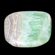 Pistachio Calcite tumbled stone 38*32*14mm 34g in sunlight - Rocks and Things Store