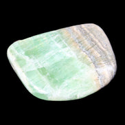 Pistachio Calcite tumbled stone 38*32*14mm 34g in sunlight - Rocks and Things Store