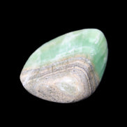 Pistachio Calcite tumbled stone 38*32*14mm 34g in sunlight - Rocks and Things Store
