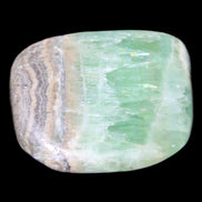 Pistachio Calcite tumbled stone 38*32*14mm 34g in sunlight - Rocks and Things Store