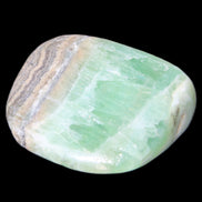 Pistachio Calcite tumbled stone 38*32*14mm 34g in sunlight - Rocks and Things Store