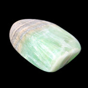 Pistachio Calcite tumbled stone 38*32*14mm 34g in sunlight - Rocks and Things Store