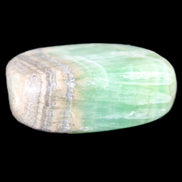 Pistachio Calcite tumbled stone 38*32*14mm 34g in sunlight - Rocks and Things Store