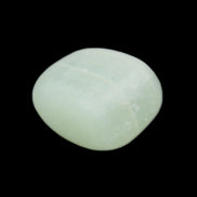 Pistachio Calcite tumbled stone 20-28mm 11-19g in sunlight - Rocks and Things Store