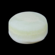 Pistachio Calcite tumbled stone 20-28mm 11-19g in sunlight - Rocks and Things Store