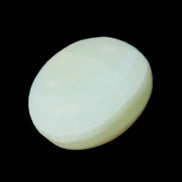 Pistachio Calcite tumbled stone 20-28mm 11-19g in sunlight - Rocks and Things Store