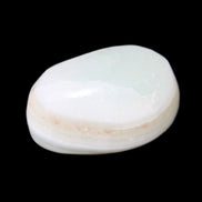 Pistachio Calcite tumbled stone 25-40mm 20-30g in sunlight - Rocks and Things Store