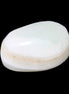 Pistachio Calcite tumbled stone 25-40mm 20-30g in sunlight - Rocks and Things Store